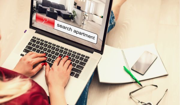 a woman searching the internet to rent a home in the netherlands