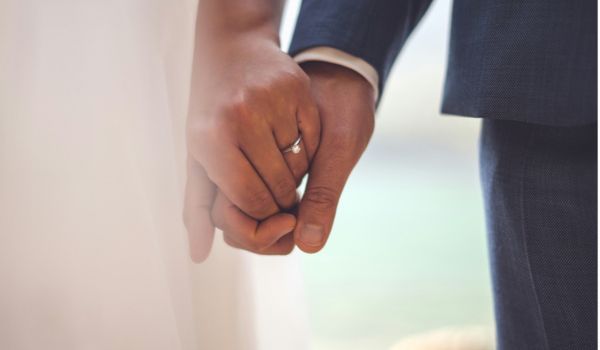 closeup of a newlywed couples hands