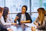 a confident dutch female executive in a board meeting