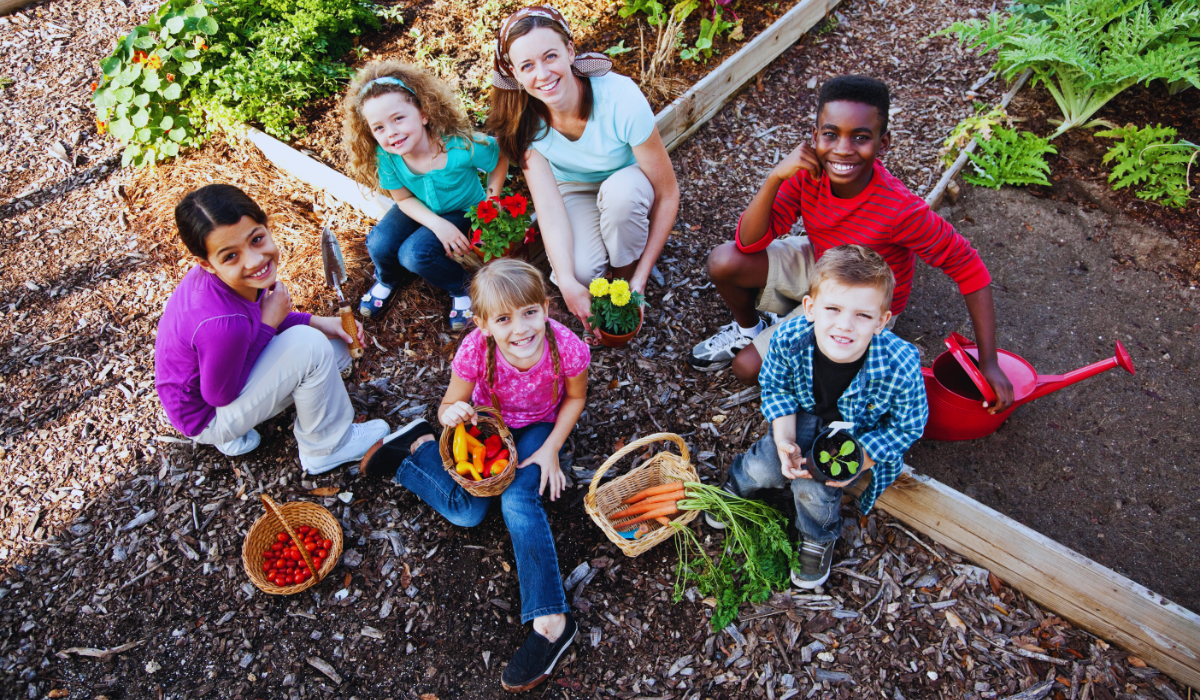 A group of children working in a community garden