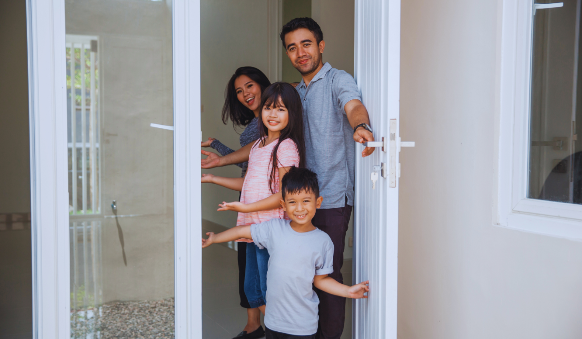 a family of four welcoming into their home