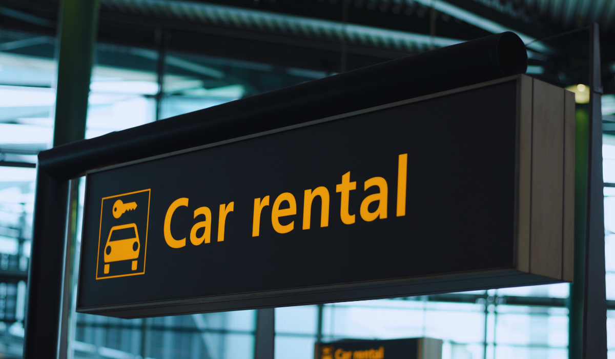 A car rental sign in the airport