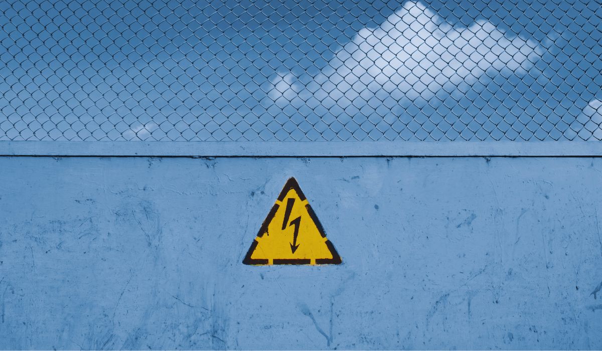 a high voltage sign on a wall