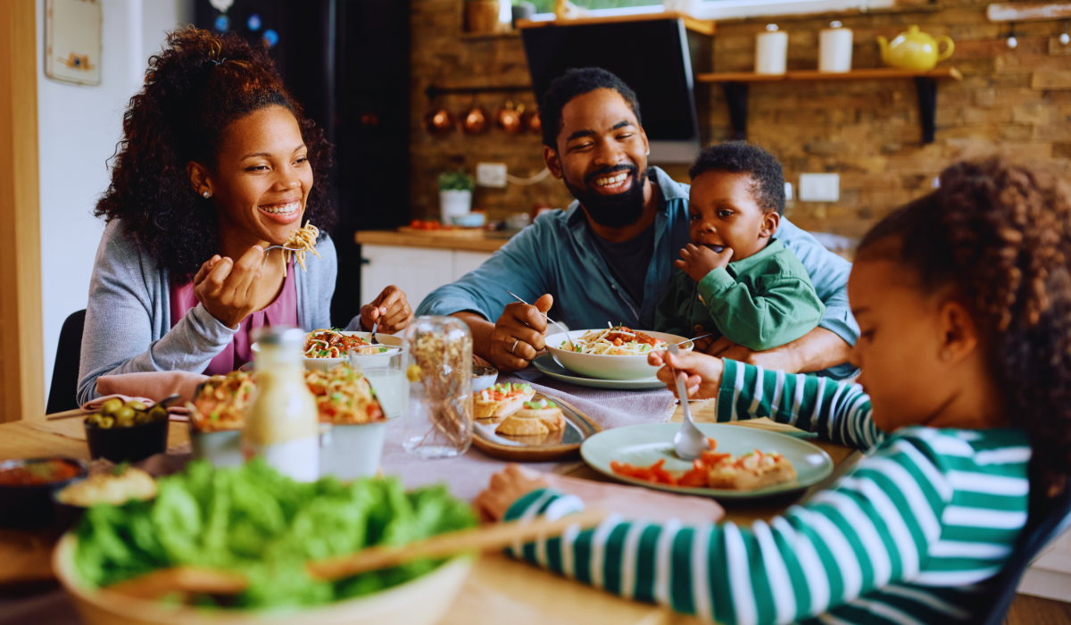 A happy family eating togetherr