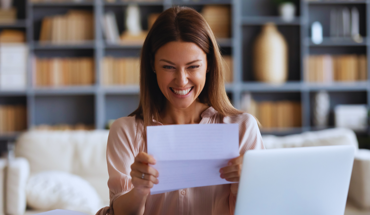 Excited woman receiving loan approval notice