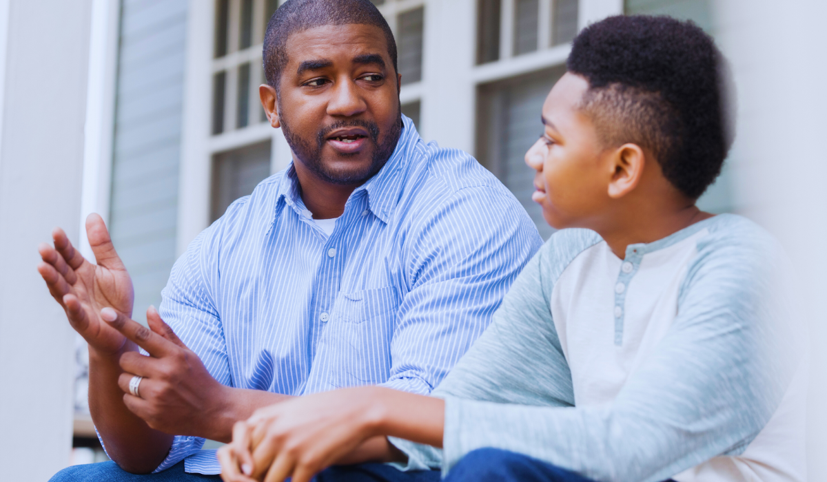 Attentive son listening to his dads advice